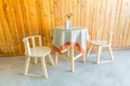 Outdoor table and two chairs near the wood wall at coffee shop, Royalty Free Stock Photo