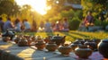 An outdoor tea ceremony takes place as the sun sets creating a serene and peaceful atmosphere for guests Royalty Free Stock Photo