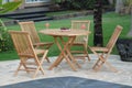 Outdoor teak garden furniture set with table and folding chairs