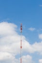 Outdoor tele communication red and white tower blue sky and cloud Royalty Free Stock Photo