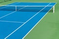 Blue Tennis court. Outdoor sunny day. Tennis concept. Copy space Royalty Free Stock Photo