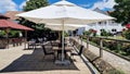 Outdoor terrace of Butoiul Sasului restaurant. Royalty Free Stock Photo