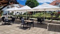 Outdoor terrace of Butoiul Sasului restaurant. Royalty Free Stock Photo