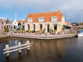 Outdoor terrace of cafe and canal in old town of Workum in Friesland, Netherlands