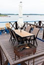 Outdoor terrace with Empty wooden table and chair with Sea view Chairs, table at the Terrace