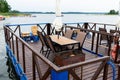 Outdoor terrace with Empty wooden table and chair with Sea view Chairs, table at the Terrace