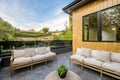 Outdoor terrace with seating areas against a cloudy blue sky Royalty Free Stock Photo