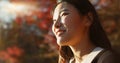 Outdoor, thinking and Asian woman with a smile, nature and forest with joy, daydreaming and holiday. Japanese person Royalty Free Stock Photo