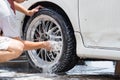 Outdoor tire car wash with sponge Royalty Free Stock Photo