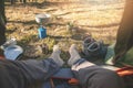 Outdoor tourism - hiker feet with wool socks out of the tent