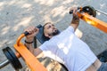 Outdoor training. Handsome bearded man doing bench press Royalty Free Stock Photo