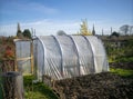 Curved pvc greenhouse on a sunny day.
