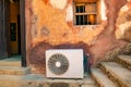 An outdoor unit of home ventilation and air conditioning system on the ruins of Fort Jesus in Kenya