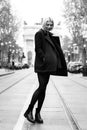 Outdoor urban female portrait, black and white. Fashion model. Young woman posing in Milan streets against Royalty Free Stock Photo