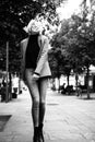 Outdoor urban female portrait, black and white. Fashion model. Young woman posing in Milan streets against. Royalty Free Stock Photo