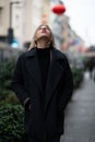 Outdoor urban female portrait. Fashion model. Young woman posing in Milan streets. Beautiful caucasian girl with blond hair Royalty Free Stock Photo