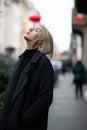 Outdoor urban female portrait. Fashion model. Young woman posing in Milan streets China town. Royalty Free Stock Photo