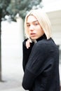 Outdoor urban female portrait, soft focus, high key. Fashion model. Young woman posing in Milan streets. Beautiful caucasian girl Royalty Free Stock Photo