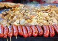 Cooking Meat, Vegetables and Sausages on a Griddle