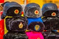 Outdoor view of assorted Russian winter hats made from rabbit fur, located in a store in the streets of Moscow