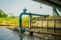 Outdoor view of blue pipeline conection under a bridge on Chao Phraya river. Thailand, Bangkok Royalty Free Stock Photo