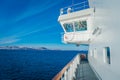 Outdoor view of Hurtigruten cruise trip, view from deck in a gorgeos blue sky and blue water Royalty Free Stock Photo