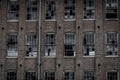 Outdoor view of rusted old building with detroyed windows, brick wall building, located in the city of Lancaster