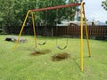 Outdoor view during sunny day with colorful playground on yard in the park. Royalty Free Stock Photo