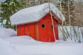 Outdoor view of traditional Norwegian mountain red cabins of wood covered with snow in a winter season in Norway Royalty Free Stock Photo