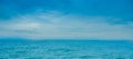 Outdoor view of two pelicans flying in a gorgeous blue sky and blue sea background in Pedernales beach Royalty Free Stock Photo