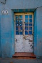 Outdoor view of white metallic door located in the Barrio Yungay in Santiago, capital of Chile