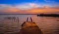 Outdoor view of wooden pier and Bacalar Lagoon suring a gorgeous sunset view in Mayan Mexico at Quintana roo, seven