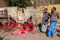 Outdoor village textile factory and workers painting clothing