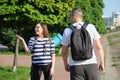 Outdoor walking man and woman, talking people, middle-aged couple Royalty Free Stock Photo