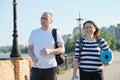 Outdoor walking man and woman, talking people, middle-aged couple Royalty Free Stock Photo