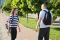 Outdoor walking man and woman, talking people middle-aged couple Royalty Free Stock Photo