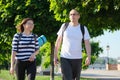 Outdoor walking man and woman, talking people, middle-aged couple Royalty Free Stock Photo