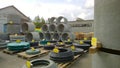 Outdoor warehouse of construction sewer materials. Stack of new reinforced concrete products. Rings for well. Cylinder Pipe.