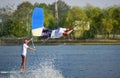 Wakeboarder man athlete performing wakeboarding jumps at cable wake park Royalty Free Stock Photo