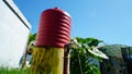 Water faucet with a hydroponic garden and green house in the background Royalty Free Stock Photo