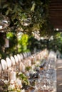 Outdoor wedding celebration at a restaurant. Festive table setting, catering. Wedding in rustic style in summer Royalty Free Stock Photo