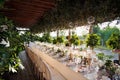 Outdoor wedding celebration at a restaurant. Festive table setting, catering. Wedding in rustic style in summer Royalty Free Stock Photo