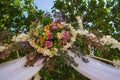 Outdoor wedding ceremony. Wedding decoration with flowers. Wedding floral arch with bouquet in garden. Marriage concept. Royalty Free Stock Photo