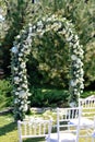 Outdoor wedding ceremony setup, wedding arch decorated Royalty Free Stock Photo