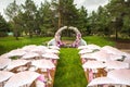 Outdoor wedding ceremony with umbrellas in the forest Royalty Free Stock Photo