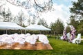 Outdoor wedding ceremony with umbrellas in the forest Royalty Free Stock Photo