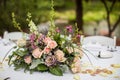 Outdoor wedding reception centerpiece featuring a vibrant display of flowers Royalty Free Stock Photo
