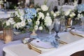 Wedding table set up in pastel blue, gold and white Royalty Free Stock Photo