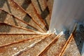 Outdoor white spiral stairs made of rusted metal and concrete Royalty Free Stock Photo