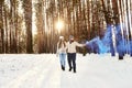 Outdoor winter cold sensual photo of a young happy beautiful couple in love walking in the forest Royalty Free Stock Photo